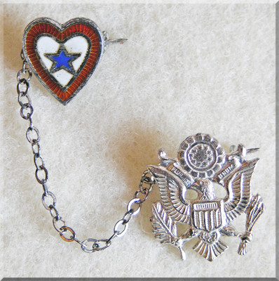 Heart love token bracelets shown next to the Omne Bonum (Latin for